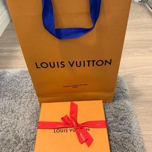 Authentic Louis Vuitton emptybox and shopping bag.